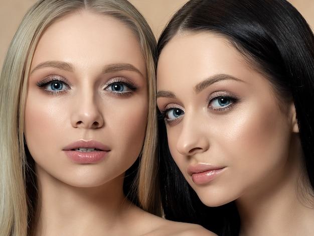 Two women with makeup showing flawless skin